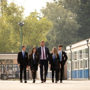 Principal walking with students